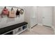 Functional mudroom area with built-in bench, storage cubbies, and beadboard accents at 1950 Parish House Cir, Johns Island, SC 29455