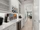 Butler's pantry featuring wine storage, ample counter space, and a coffee bar at 1950 Parish House Cir, Johns Island, SC 29455