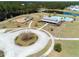 An aerial view of the community amenities, including a playground, pool, and pavilion nestled in a lush landscape at 199 Decatur Dr, Summerville, SC 29486