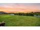 Expansive backyard overlooking a tranquil lake, perfect for outdoor relaxation and enjoying scenic views at 199 Decatur Dr, Summerville, SC 29486