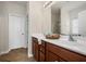 Bathroom with double sink vanity, wood cabinets, tile floors and framed mirror at 199 Decatur Dr, Summerville, SC 29486
