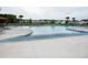 A large community pool with plenty of lounge chairs and umbrellas in the background on a cloudy day at 199 Decatur Dr, Summerville, SC 29486