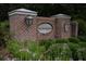 Charming brick community sign at Old Rice Retreat with beautiful landscaping and decorative outdoor lantern at 199 Decatur Dr, Summerville, SC 29486