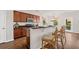 Cozy kitchen features dark countertops, wood cabinetry, a breakfast bar, and modern appliances at 199 Decatur Dr, Summerville, SC 29486