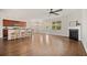 Spacious open-concept living space featuring hardwood floors, a fireplace, and a breakfast bar at 199 Decatur Dr, Summerville, SC 29486
