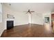 Open living room with fireplace, hardwood floors, and a view of the entryway at 199 Decatur Dr, Summerville, SC 29486