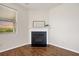 Cozy corner with hardwood floors, fireplace, mantle, and natural light from the window at 199 Decatur Dr, Summerville, SC 29486