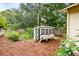 Backyard showcasing a chicken coop and lush green vegetation at 202 Chandler Dr, Ladson, SC 29456