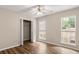Bedroom features wood floors, a ceiling fan, a closet, and two windows at 202 Chandler Dr, Ladson, SC 29456