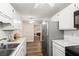 Bright eat-in kitchen with subway tile backsplash, stainless steel appliances, and white cabinetry at 202 Chandler Dr, Ladson, SC 29456