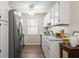 Bright eat-in kitchen with subway tile backsplash, stainless steel appliances, and white cabinetry at 202 Chandler Dr, Ladson, SC 29456