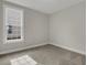 Bright bedroom features neutral walls, plush carpet and a window for natural light at 2020 Grange Cir, Summerville, SC 29486