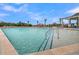 View of community pool with a pool house, lounge chairs, and palm trees at 2020 Grange Cir, Summerville, SC 29486
