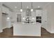 Bright kitchen featuring an island with quartz countertops, stainless steel appliances, and wood floors at 2020 Grange Cir, Summerville, SC 29486