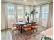 Elegant dining room with a modern table, stylish chairs, and large windows providing ample natural light at 2050 Mcguire Ln # 13, Hollywood, SC 29449