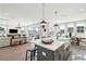 Open-concept living area with a kitchen island, dining space, and comfortable seating arrangement at 2050 Mcguire Ln # 13, Hollywood, SC 29449