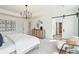 Bright main bedroom featuring neutral color tones, a chandelier, and a barn door at 2050 Mcguire Ln # 13, Hollywood, SC 29449
