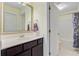 Bathroom with vanity, decorative mirror and view of bathtub and shower at 206 President Cir, Summerville, SC 29483