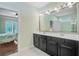 Double sink vanity in bathroom with ample counter space and an oversized mirror at 206 President Cir, Summerville, SC 29483