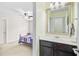 Bathroom view showcasing vanity with decorative mirror and an adjoining bedroom at 206 President Cir, Summerville, SC 29483