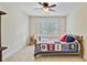 Cozy bedroom with a ceiling fan, bed, and large window at 206 President Cir, Summerville, SC 29483