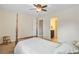Bedroom with four poster bed, chair, and view into attached bathroom at 206 President Cir, Summerville, SC 29483