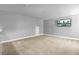 Spacious bonus room with neutral carpet and a TV at 206 President Cir, Summerville, SC 29483
