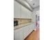 Bright butler's pantry featuring granite countertops, tiled backsplash, and white cabinets at 206 President Cir, Summerville, SC 29483