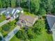Home with a well-kept lawn, mature trees, and a driveway that leads to an attached garage at 206 President Cir, Summerville, SC 29483