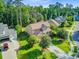 Charming two-story home featuring a well-manicured lawn and a long driveway leading to a side-entry garage at 206 President Cir, Summerville, SC 29483