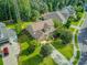 Home with a well-kept lawn and mature trees, with a driveway leading to an attached garage at 206 President Cir, Summerville, SC 29483