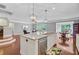 Open concept kitchen with a large island, stainless steel appliances, and hardwood floors at 206 President Cir, Summerville, SC 29483