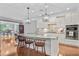 Modern kitchen island with granite countertop, pendant lighting, and open to the living area at 206 President Cir, Summerville, SC 29483