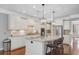 Modern kitchen with stainless steel appliances, a large island, and pendant lighting at 206 President Cir, Summerville, SC 29483
