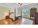 Spacious main bedroom with hardwood floors, tray ceiling and a large window at 206 President Cir, Summerville, SC 29483