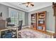 Cozy home office featuring classic bookshelves, a comfortable desk, and natural light from the window at 206 President Cir, Summerville, SC 29483
