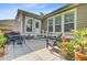 Back patio featuring outdoor seating, potted plants, and access to the home's interior at 206 President Cir, Summerville, SC 29483