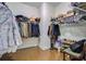 Spacious walk-in closet with custom shelving, racks, and hardwood flooring at 206 President Cir, Summerville, SC 29483