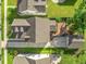 Aerial view of a residential home showcasing a brick patio, lush greenery, and a detached garage at 2234 Kemmerlin St, Johns Island, SC 29455