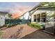 A brick-paved backyard is adjacent to a two story home, landscaping and fencing at 2234 Kemmerlin St, Johns Island, SC 29455