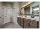 The bathroom showcases a double vanity, large mirror, and modern lighting fixtures, providing a luxurious feel at 2234 Kemmerlin St, Johns Island, SC 29455