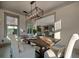 Bright dining area featuring a rustic wooden table and view into the kitchen at 2234 Kemmerlin St, Johns Island, SC 29455