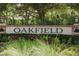 Welcome to Oakfield community, sign featuring manicured landscaping and decorative lighting at 2234 Kemmerlin St, Johns Island, SC 29455