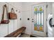 Charming entryway featuring a decorative glass door and a convenient bench at 2234 Kemmerlin St, Johns Island, SC 29455
