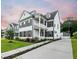 Charming two-story home featuring a balcony, manicured landscaping, and a detached garage at 2234 Kemmerlin St, Johns Island, SC 29455