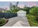 Detached two-car garage with a well-maintained driveway, surrounded by lush landscaping and a green fence at 2234 Kemmerlin St, Johns Island, SC 29455