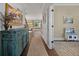 Well-lit hallway featuring a unique cabinet and hardwood flooring at 2234 Kemmerlin St, Johns Island, SC 29455