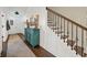 A bright hallway, with wood floors and stairs featuring decorative iron at 2234 Kemmerlin St, Johns Island, SC 29455