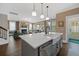 Open concept kitchen with a stone counter top island and a view into the living space at 2234 Kemmerlin St, Johns Island, SC 29455