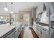 Bright, updated kitchen with stainless appliances, stone countertops, and a center island at 2234 Kemmerlin St, Johns Island, SC 29455